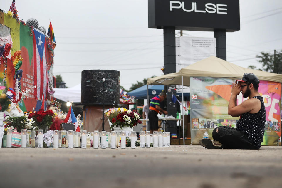 Jose Ramirez, a&nbsp;survivor of the Pulse massacre, reacts as he visits the site one year after the shooting. (Photo: Joe Raedle via Getty Images)