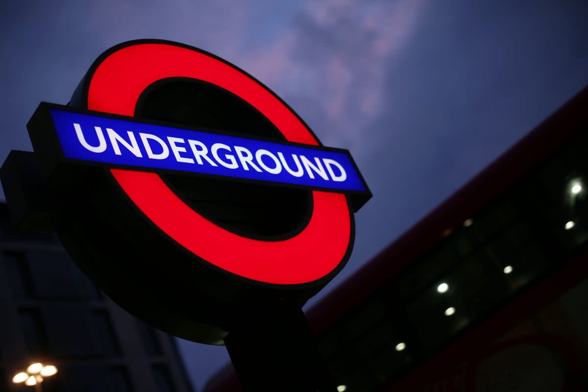 File photo of a London Underground sign against the night sky (Yui Mok/PA). (PA Archive)
