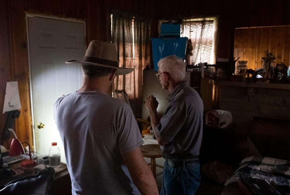 Ron Ryan, left, has an insurance adjuster look at his home to see what is still salvageable after a Wednesday afternoon house explosion at 1010 N. Weinbach Ave., in Evansville, Ind., Friday afternoon, Aug. 12, 2022.