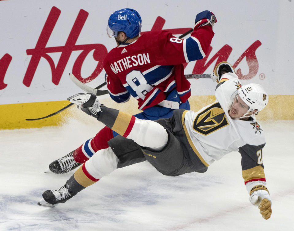 Vegas Golden Knights' Brett Howden (21) is upended by Montreal Canadiens' Mike Matheson (8) during the second period of an NHL hockey game Thursday, Nov. 16, 2023, in Montreal. (Christinne Muschi/The Canadian Press via AP)