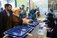 Ali Akbar Nategh-Nouri casts his vote into a ballot box during the presidential election in Tehran, Iran, May 19, 2017. TIMA via REUTERS