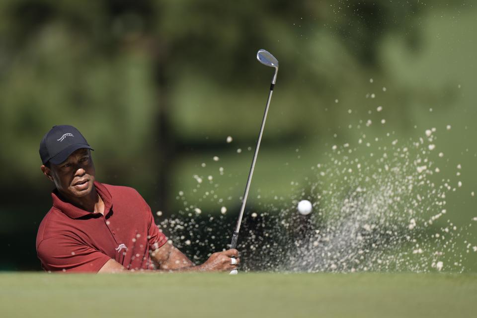 Tiger Woods hits from the bunker on the seventh hole during final round at the Masters golf tournament at Augusta National Golf Club Sunday, April 14, 2024, in Augusta, Georgia. / Credit: Charlie Riedel / AP