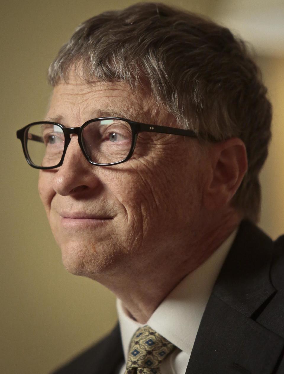 Philanthropists Bill Gates listens during an interview on Tuesday, Jan. 21, 2014, in New York. Gates pitched an optimistic future for the world's poor and sick his annual letter, arguing passionately against three myths he said hurt efforts to bring people out of poverty, save lives and improve living conditions. (AP Photo/Bebeto Matthews)