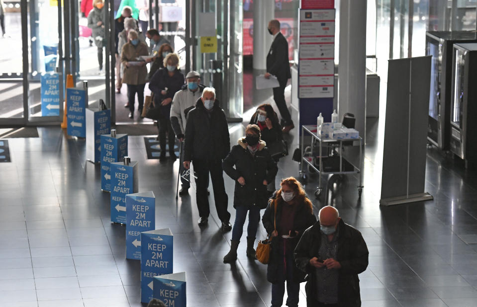 People queuing to receive an injection of a Covid-19 vaccine at the NHS vaccine centre that has been set up at the Millennium Point centre in Birmingham. The centre is one of the seven mass vaccination centres now opened to the general public as the government continues to ramp up the vaccination programme against Covid-19.