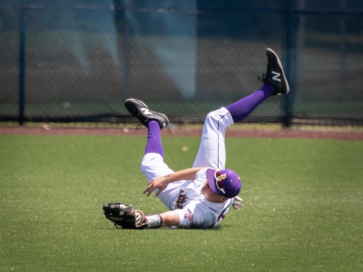 Blissfield's Ethan Stines made a diving catch in center field during Saturday's Division 3 regional final at Grosse Pointe Woods University Liggett.