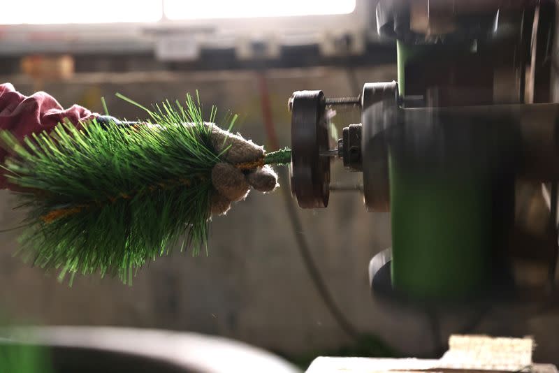 FILE PHOTO: Staff produce parts of a Christmas tree at the factory of Lien Teng Enterprise in Taichung