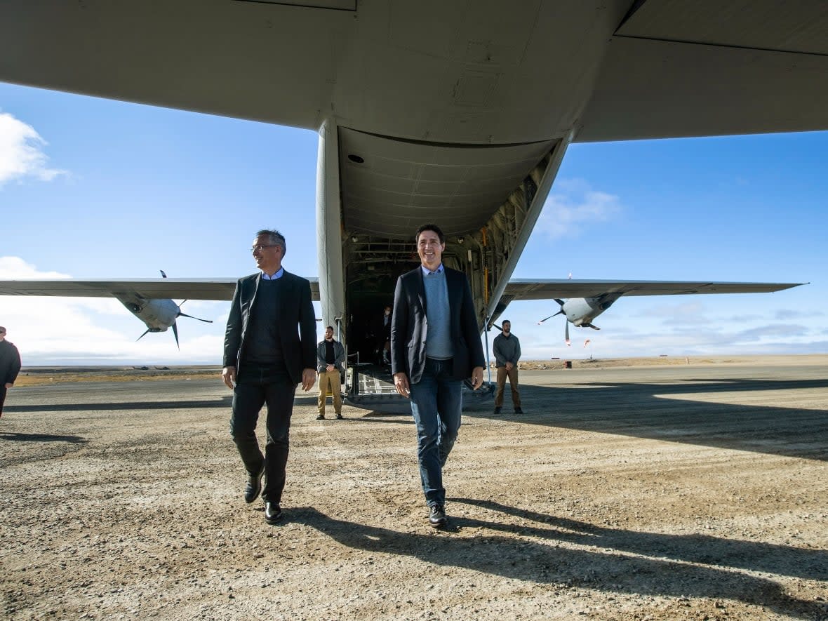 NATO Sec. Gen. Jens Stoltenberg and Prime Minister Justin Trudeau arrive in Cambridge Bay, Nunavut, on Aug. 25, 2022. A letter signed by members of Canada's political and military elite say Canada can no longer afford to give short shrift to national security. (Jason Franson/The Canadian Press - image credit)