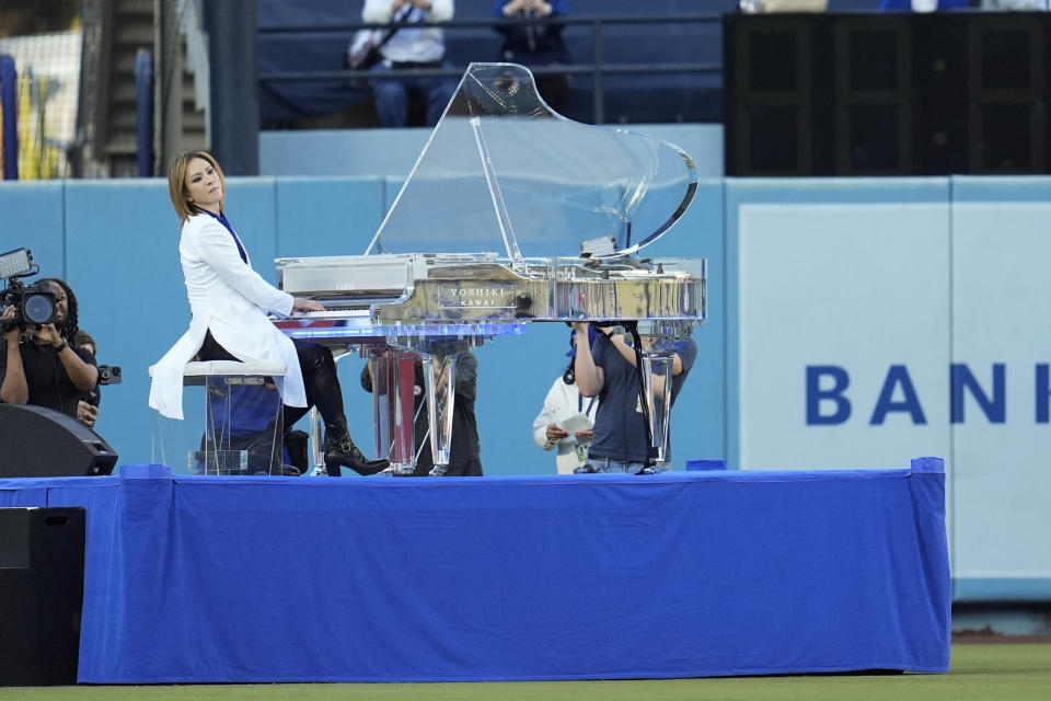 Yoshiki performs before a baseball game between the Los Angeles Dodgers and the Washington Nationals, Tuesday, April 16, 2024, in Los Angeles. (AP Photo/Marcio Jose Sanchez)