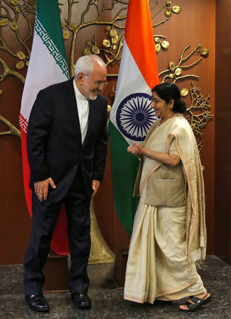 Iran's Foreign Minister Mohammad Javad Zarif speaks with his Indian counterpart Sushma Swaraj during a photo opportunity in New Delhi, India, May 28, 2018. REUTERS/Altaf Hussain