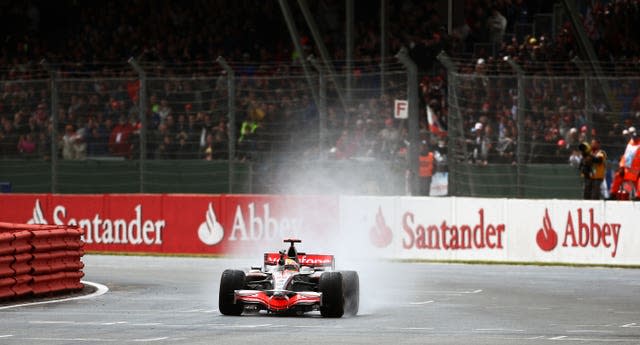 McLaren driver Lewis Hamilton in the final corner before the chequered flag for his victory at the British Grand Prix at Silverstone