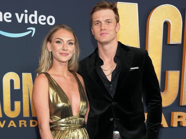 <p>Kevin Mazur/Getty</p> Hallie Ray Light and Parker McCollum attend the 57th Academy of Country Music Awards on March 07, 2022 in Las Vegas, Nevada.