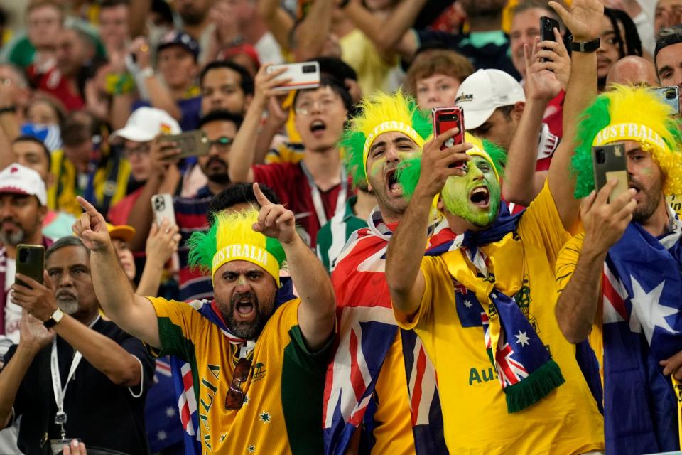 Australia fans cheer prior the World Cup group D football match between Australia and Denmark, at the Al Janoub Stadium in Al Wakrah, Qatar, Wednesday, Nov. 30, 2022. (AP Photo/Francisco Seco)