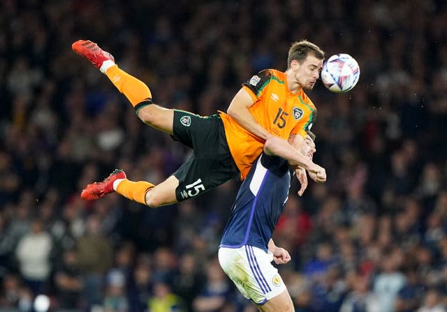 The Republic of Ireland’s Jayson Molumby jumps higher than Scotland’s John McGinn