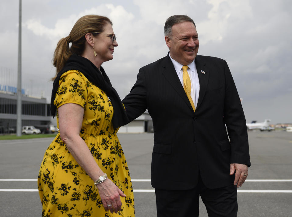 US Secretary of State, Mike Pompeo, right, and his wife, Susan Pompeo walk on the tarmac before leaving Angola at the Luanda International Airport in Luanda, Angola, Monday Feb. 17, 2020. Pompeo started his tour of Africa in Senegal, the first U.S. Cabinet official to visit in more than 18 months. He left Senegal Sunday to arrive in Angola and will then travel on to Ethiopia as the Trump administration tries to counter the growing interest of China, Russia and other global powers in Africa and its booming young population of more than 1.2 billion. (Andrew Caballero-Reynolds/Pool via AP)