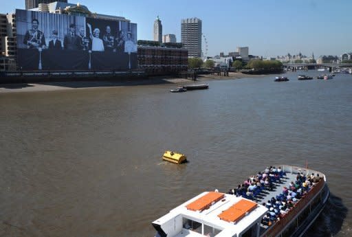 A giant photo of Britain's royal family is unveiled on a building beside the River Thames in London on May 25. Celebrations for Queen Elizabeth II's diamond jubilee reach their climax on June 3 when a flotilla of 1,000 boats sails up the River Thames