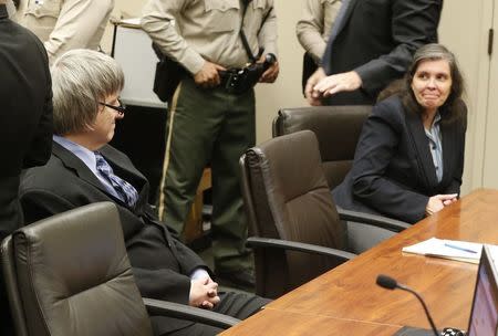 David Turpin and Louise Turpin glance at each other as they appear in court in Riverside, California, U.S., February 23, 2018. REUTERS/Damian Dovarganes/Pool