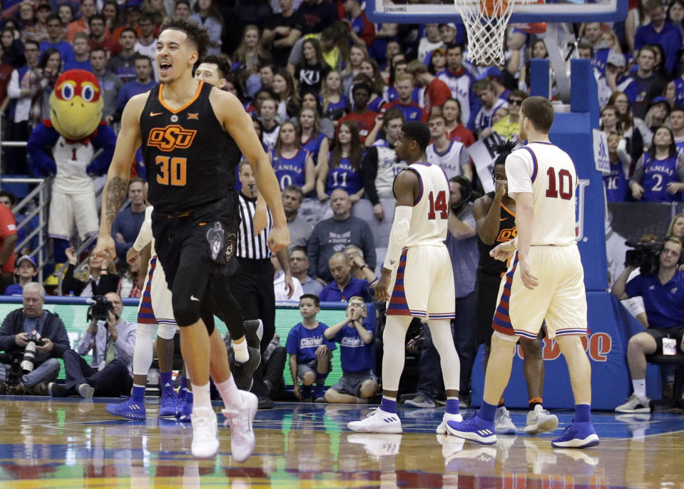 Oklahoma State guard Jeffrey Carroll celebrates following the Cowboys’ victory over No. 7 Kansas 84-79. (AP Photo)