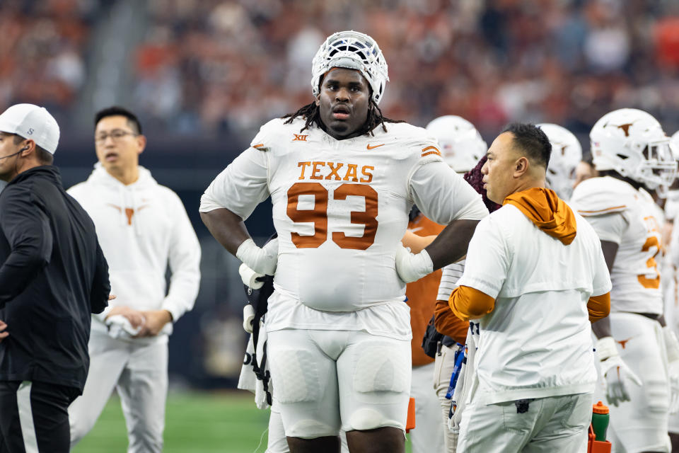 Texas Longhorns defensive lineman T'Vondre Sweat looks up field during a timeout during the 2023 Big 12 Championship football game.