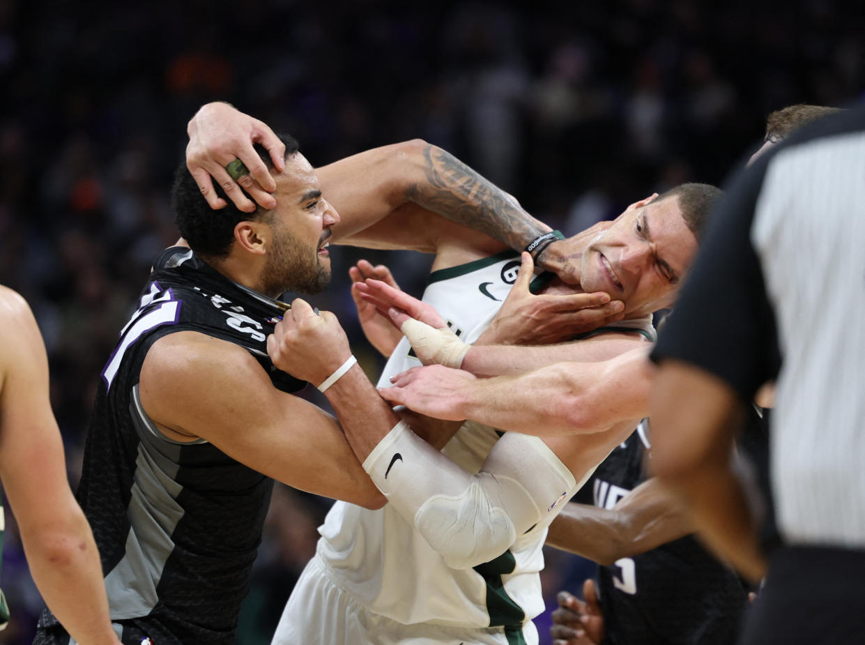 Mar 13, 2023; Sacramento, California, USA; Sacramento Kings center Trey Lyles (41) confronts Milwaukee Bucks center Brook Lopez (11) during the fourth quarter at Golden 1 Center. Mandatory Credit: Kelley L Cox-USA TODAY Sports