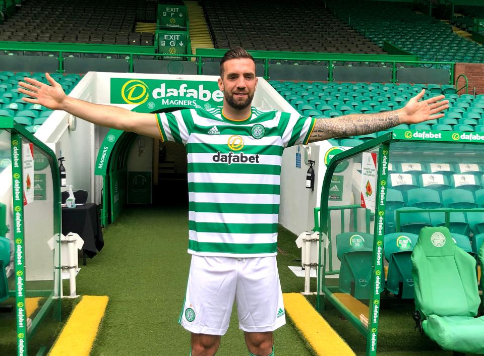 Shane Duffy poses at Celtic Park after moving to Glasgow from Brighton (PA)