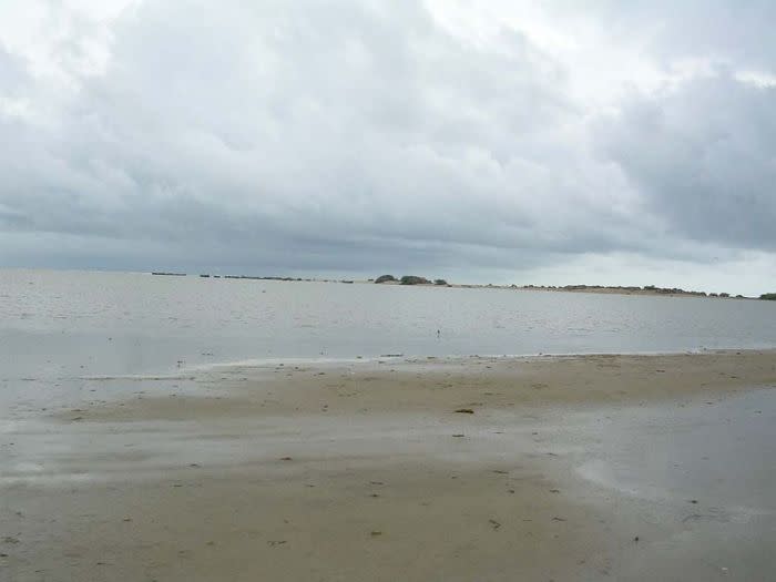 A distant view of Dhanushkodi town from a vehicle. Pilgrims from all over India visit Rameswaram Temple to bathe in the holy wells and in the sea. It is a well-known pilgrimage site. Only a few, though, know the mythological and historical importance of nearby Dhanushkodi.<br><b><br>ABOUT THE PHOTOGRAPHER: </b><br><b>J MADHU RANTHAKAN</b> is a software professional and a hobbyist photographer interested in sculptures and heritage temple architecture. He also loves photographing nature and children. He is a native of Pollachi in Coimbatore district of Tamil Nadu.