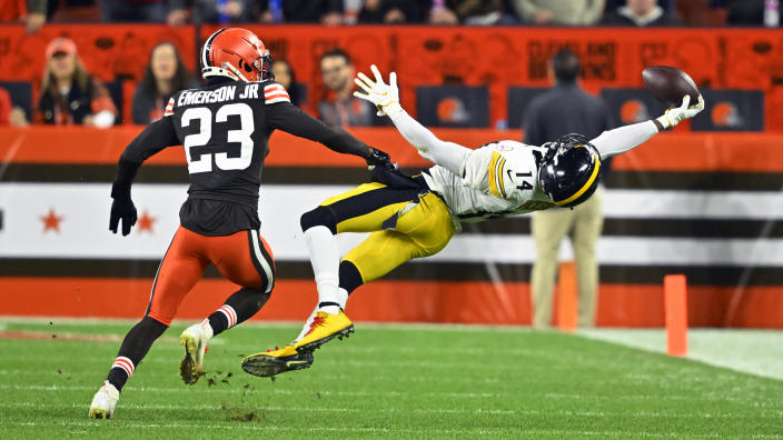 Pittsburgh Steelers wide receiver George Pickens (14) makes a one handed catch with Cleveland Browns cornerback Martin Emerson Jr. (23) defending during the first half of an NFL football game in Cleveland, Thursday, Sept. 22, 2022. (AP Photo/David Richard)