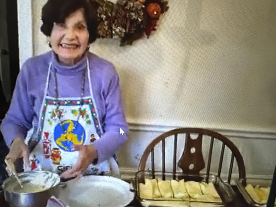 AP writer Anne D'Innocenzio's late mother Marie D'Innocenzio makes manicottis in the kitchen at her home, on Nov. 13, 2016, in suburban New Jersey. D'Innocenzio sold her childhood home in late June 2023, after her mother passed away, saying goodbye to more than a half century of memories. (Anne D'Innocenzio via AP)