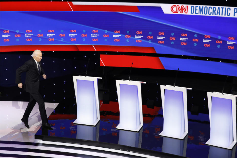 FILE - In this Jan. 14, 2020, file photo Democratic presidential candidates former Vice President Joe Biden, takes the stage before a Democratic presidential primary debate hosted by CNN and the Des Moines Register in Des Moines, Iowa. Biden has won the last few delegates he needed to clinch the Democratic nomination for president. (AP Photo/Patrick Semansky, File)