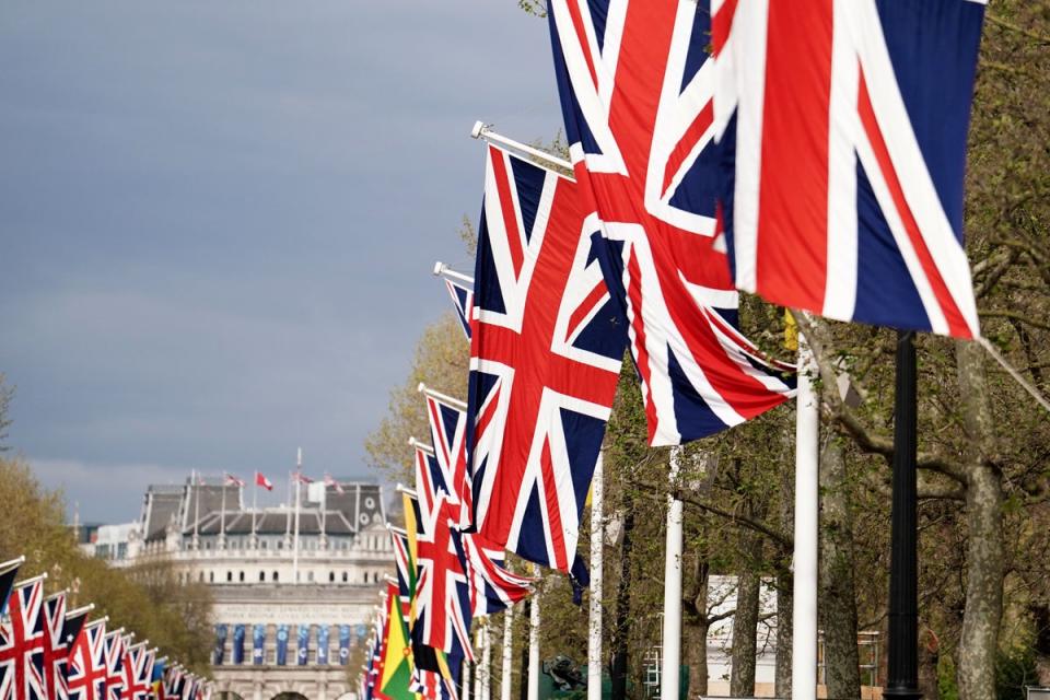 Pall Mall leading up to Buckingham Palace is already buzzing with excitement as people set up tents (PA Wire)