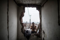 <p>A Pakistani migrant shaves his beard at an abandoned warehouse near the Central train station in Belgrade, Serbia, Feb. 1, 2017. (Manu Brabo/MeMo) </p>