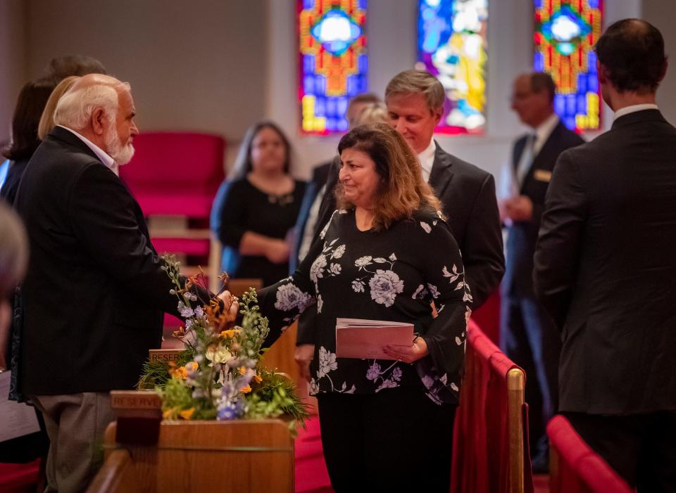  Paula Dockery , widow of Doc Dockery , receives condolences from Tom Petcoff as family members enter the funeral services for CC Doc Dockery at First Methodist Church in Lakeland Fl. Thursday August 11,  2022.  ERNST PETERS/ THE LEDGER