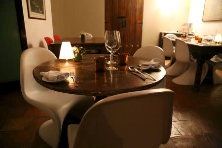 A dining area of "La Isabela" is seen at restaurateur Eduardo Moreno's home which doubles as a restaurant, in Caracas June 6, 2015. As with living-room restaurants that flourished in nineties Havana after the fall of its Soviet benefactor, Caracas is seeing a rise in clandestine dining as inventive restaurateurs seek ways to survive economic crisis, corruption and crime. REUTERS/Girish Gupta