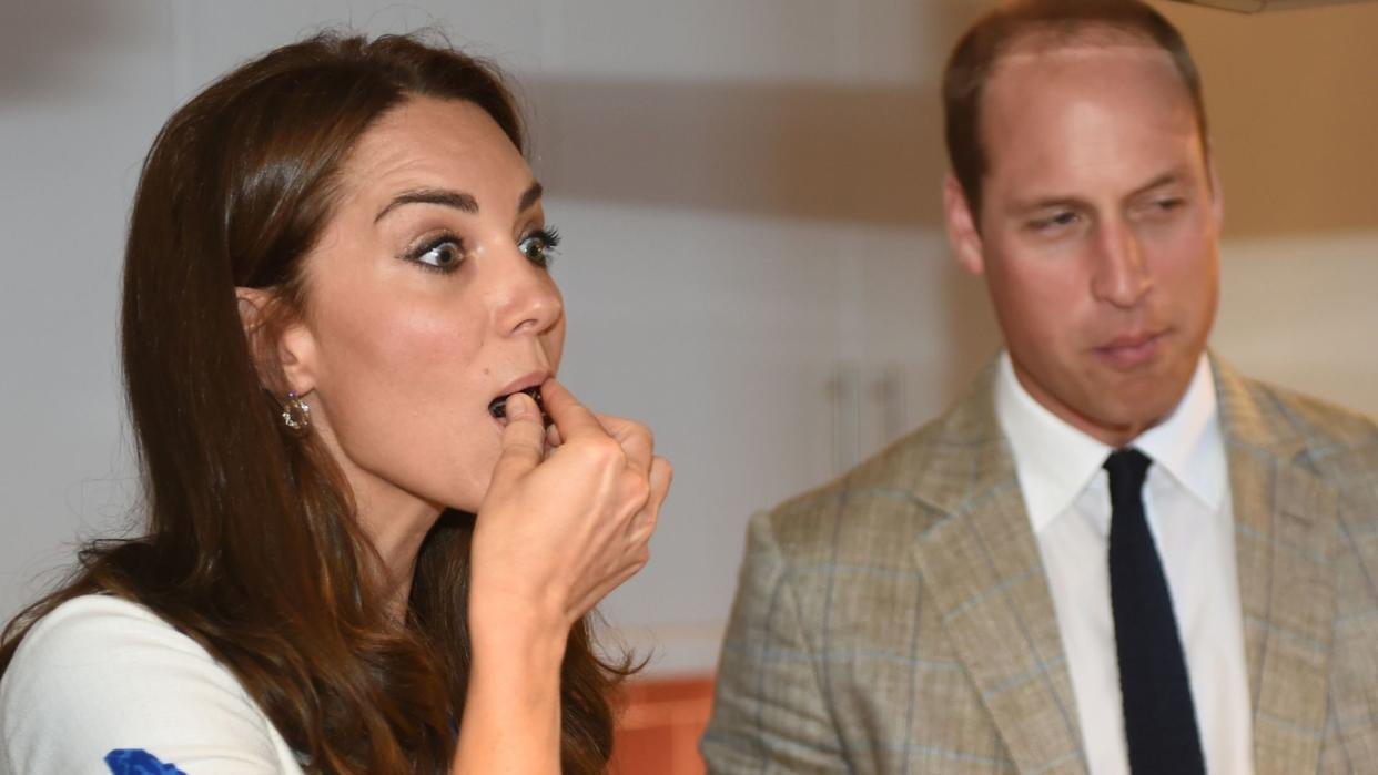 Prince William and Princess Kate eating cake