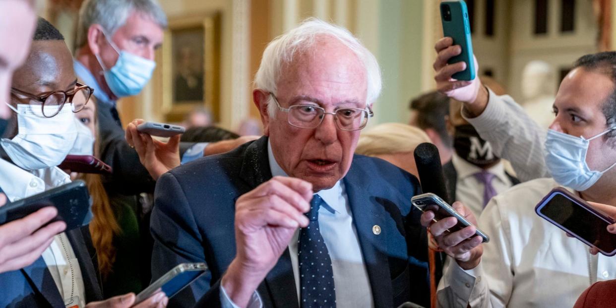 Sen. Bernie Sanders, I-Vt., speaks to reporters as he leaves a Democratic strategy meeting at the Capitol in Washington, Tuesday, Oct. 19, 2021.