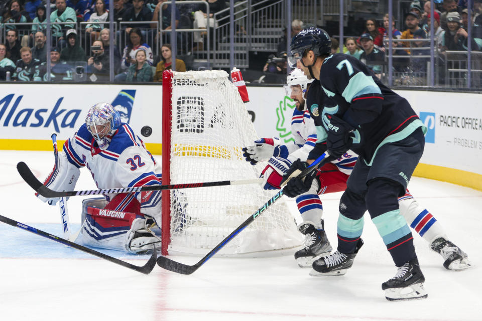 Seattle Kraken right wing Jordan Eberle (7) tries to score on New York Rangers goaltender Jonathan Quick (32) during the first period of an NHL hockey game Saturday, Oct. 21, 2023, in Seattle. (AP Photo/Jason Redmond)