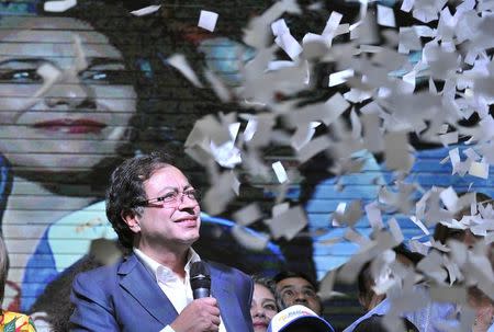 Presidential candidate Gustavo Petro is showered with confetti as he addresses supporters after being defeated by Ivan Duque in Colombia's presidential election, in Bogota, Colombia, June 17, 2018. REUTERS/Carlos Julio Martinez