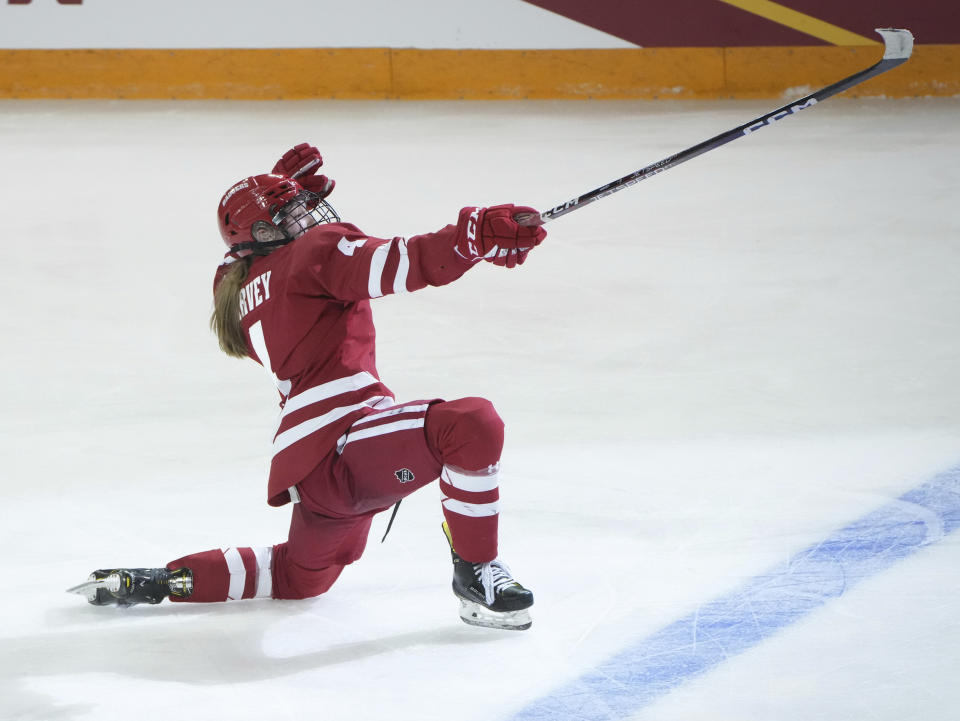 FILE - Wisconsin defenseman Caroline Harvey (4) celebrates after scoring in overtime against Minnesota in an NCAA Frozen Four semifinal in Duluth, Minn., Friday, March 17, 2023. In 13 short months, United States defender Caroline Harvey has put aside a lack of playing time at the Beijing Winter Games to winning an NCAA Tournament title to close her freshman season at Wisconsin and establishing herself as key fixture on a young, retooling American team at the women's world hockey championships. (Shari L. Gross/Star Tribune via AP, File)