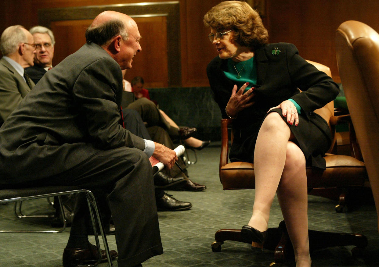CIA Director James Woolsey talks to Sen. Dianne Feinstein before a hearing before the Senate intelligence committee in 2004. 