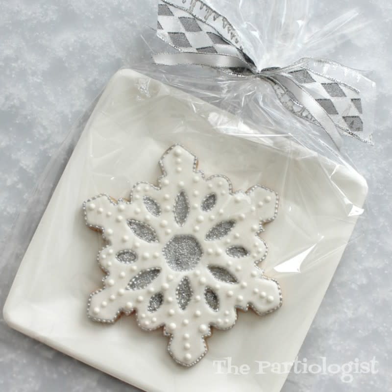 <p>The Partiologist</p><p>A snowflake cookie gets an elegant touch with white and silver icing.</p><p><strong>Get the recipe: <a href="https://www.thepartiologist.com/2019/07/christmas-cookies-in-july.html" rel="nofollow noopener" target="_blank" data-ylk="slk:Jumbo Snowflake Cookie;elm:context_link;itc:0;sec:content-canvas" class="link ">Jumbo Snowflake Cookie</a></strong></p>