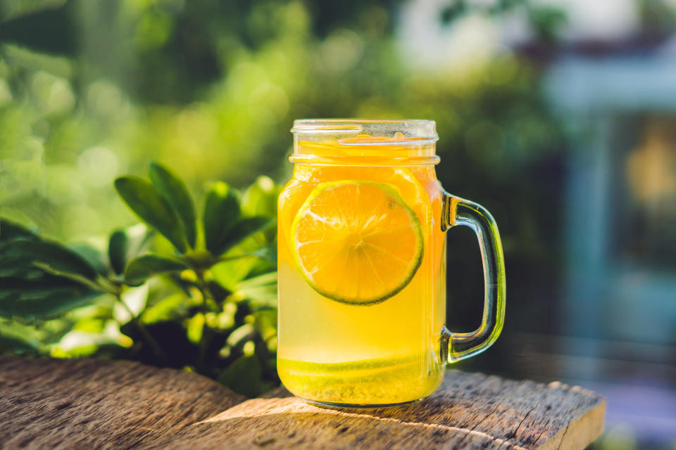 Homemade Fermented Raw Kombucha Tea Ready to Drink With orange and lime. Summer. (Photo: Getty Images)