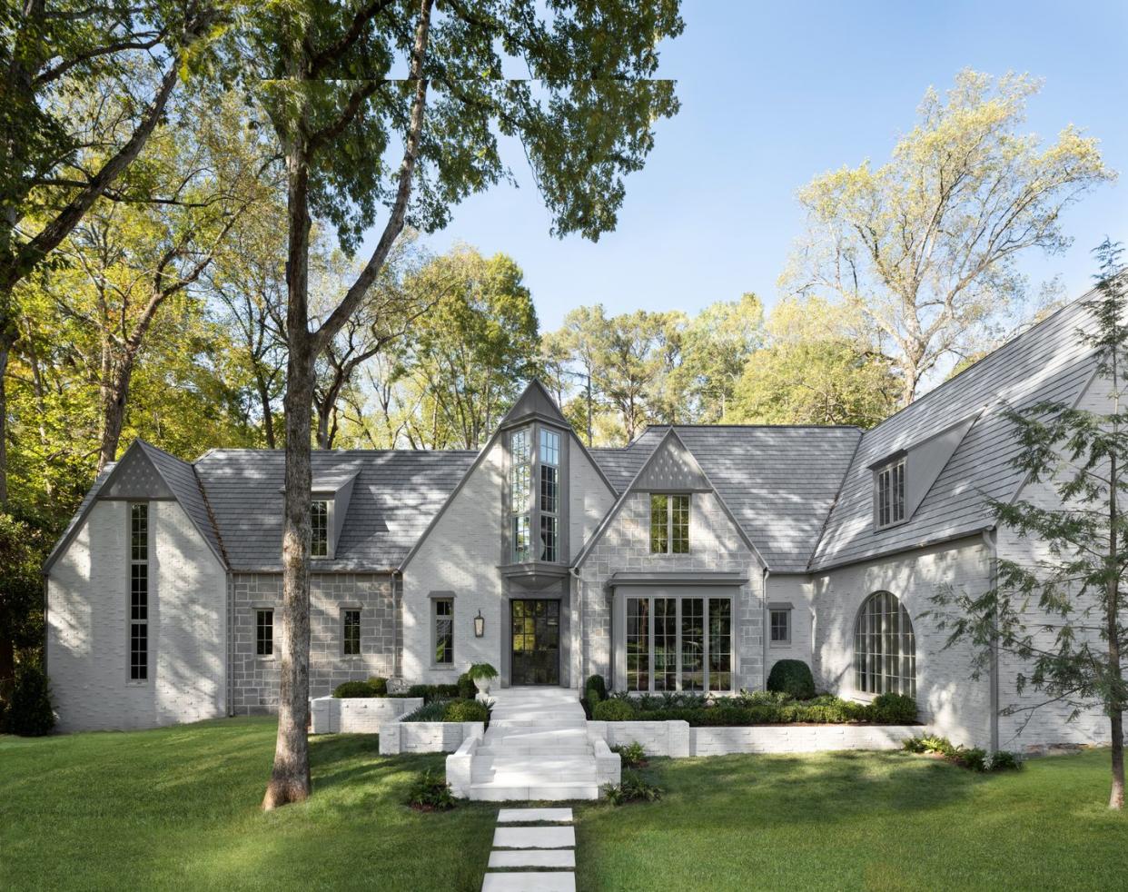 exterior the facade was updated with architectural windows from pella and paint in moles breath and purbeck stone by farrow ball a new pivoting steel door with a schlage smart lock grants guests access from afar 5th annual whole home