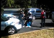 This video frame grab obtained September 23, 2016, taken by Rakeyia Scott, courtesy of Curry Law Firm, shows the moments after the shooting of Keith Lamont Scott in Charlotte, North Carolina