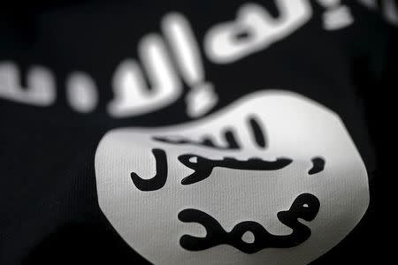 An Islamic State flag is seen in this picture illustration taken February 18, 2016. REUTERS/Dado Ruvic/Illustration