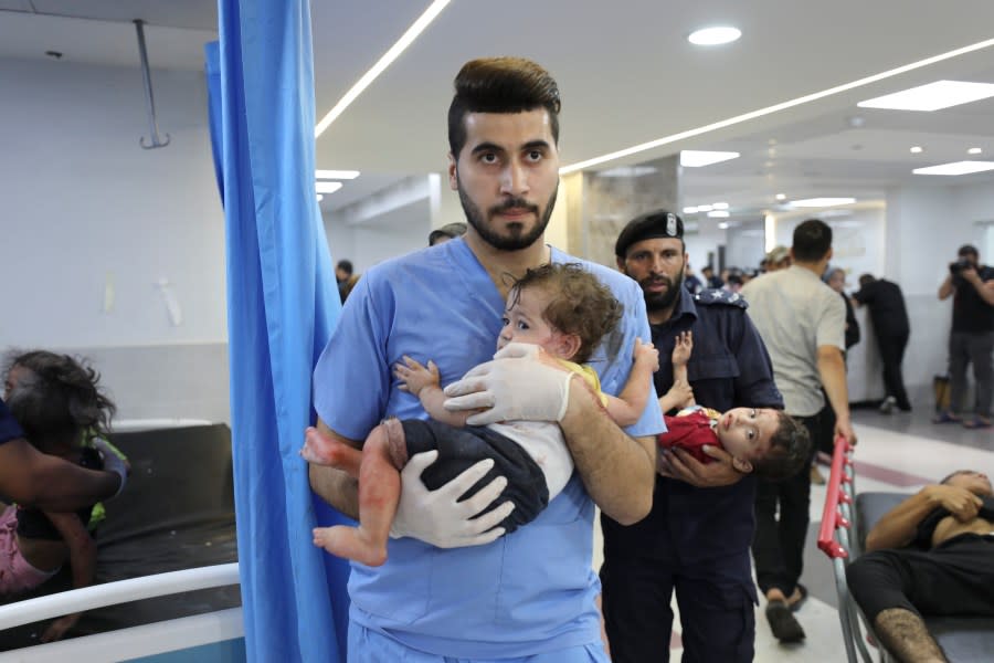 Palestinian children wounded in Israel strikes are brought to Shifa Hospital in Gaza City on Wednesday, Oct. 11, 2023. (AP Photo/Ali Mahmoud)