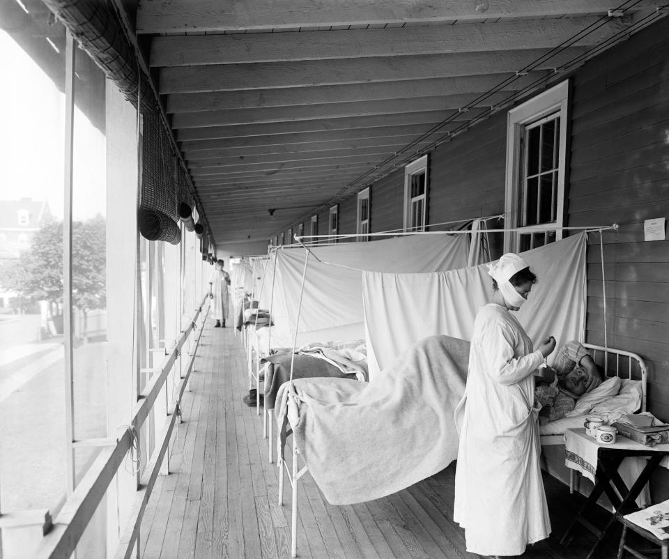 Nurse checking with flu patient