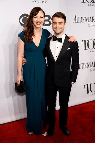 <p>Dimitrios Kambouris/Getty</p> Erin Darke and Daniel Radcliffe attend the 68th Annual Tony Awards at Radio City Music Hall on June 8, 2014 in New York City