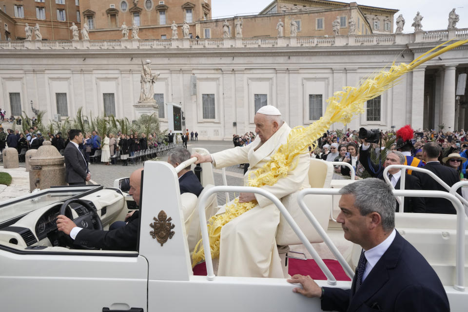 Pope Francis sits on the popemobile on his way to the altar to celebrate the Palm Sunday's mass in St. Peter's Square at The Vatican Sunday, April 2, 2023 a day after being discharged from the Agostino Gemelli University Hospital in Rome, where he has been treated for bronchitis, The Vatican said. The Roman Catholic Church enters Holy Week, retracing the story of the crucifixion of Jesus and his resurrection three days later on Easter Sunday. (AP Photo/Andrew Medichini)