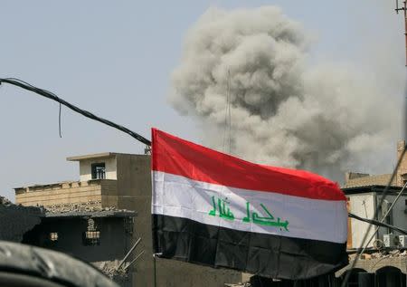 FILE PHOTO: Smoke rises from an air strike in the Old City of Mosul, Iraq July 9, 2017. REUTERS/Alaa Al-Marjani