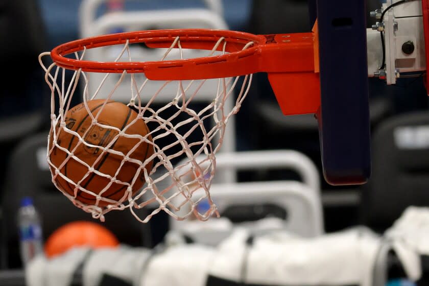 WASHINGTON, DC - DECEMBER 19: Basketballs go through the hoop during warmups of the Detroit Pistons.