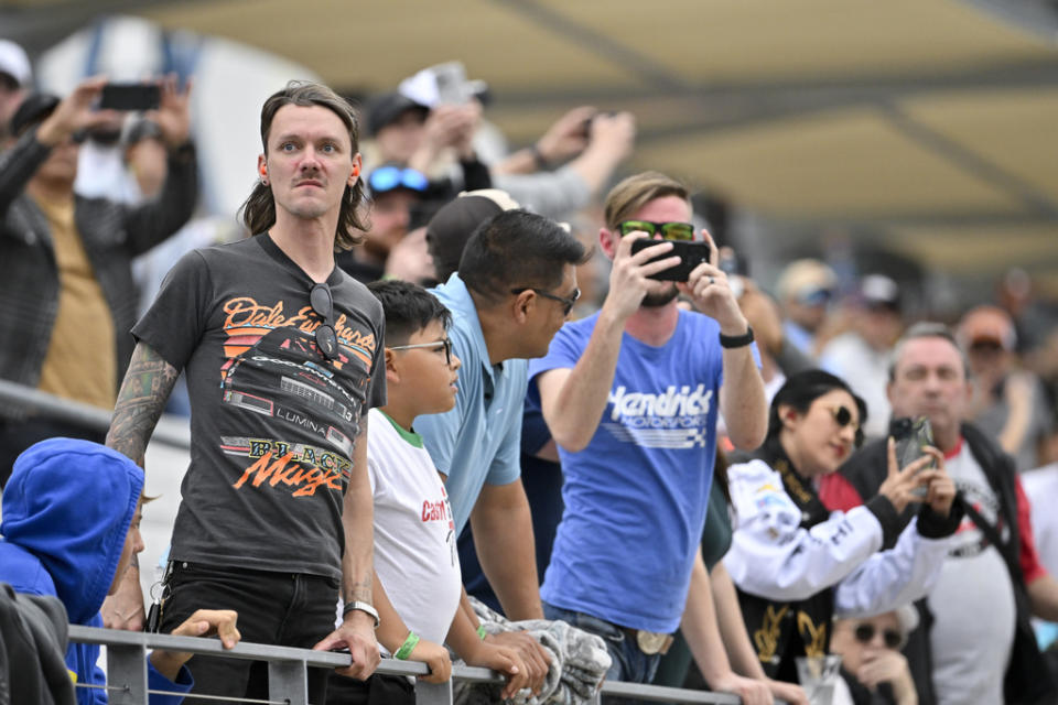 Fans watch the start of the third stage of a NASCAR Cup Series auto race Sunday, March 24, 2024, at Circuit of the Americas in Austin, Texas. (AP Photo/Darren Abate)